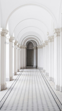 White arch corridor with tiled floor in 19th century