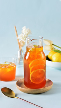 A Cup of Cold Lemon Black Tea on the Blue Plate