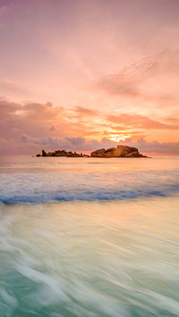 Soft wave of the turquoise sea on the sandy beach