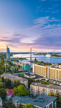 Riga city panorama with colorful sunset in the sky