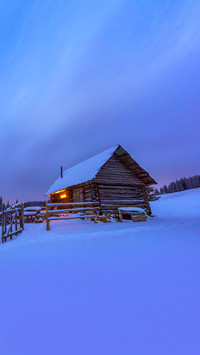 Fantastic landscape with snowy house