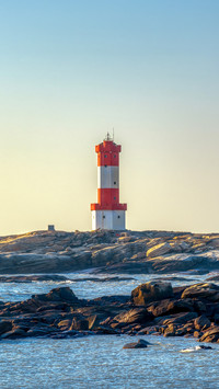 Lighthouse on the coast in sunrise