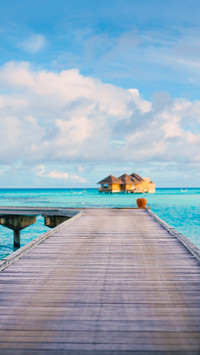View of a water bungalow from a pontoon in the maldives