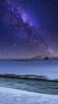 The starry sky at the seljaland waterfall in iceland