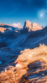 Mountains with beautiful house and church at sunset in autum