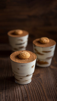 Dessert with coffee on a wooden background
