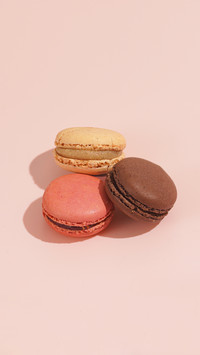 Stacked pink and chocolate macarons