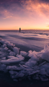 Evening glow on frozen lake