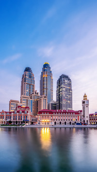 Modern Skyline Reflected in River, A City's Nighttime Charm