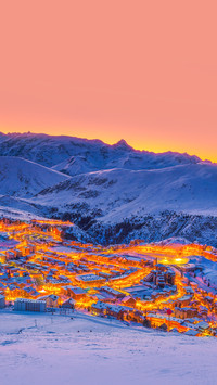 Fantastic winter ski resort with buildings at dawn
