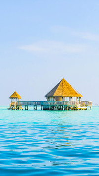The wooden villas, standing on waters of the Indian Ocean