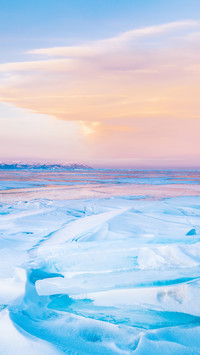 Blue ice-drift at the sunset. Baikal lake, Russia