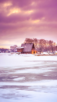 View of a frozen lake during sunrise in winter season