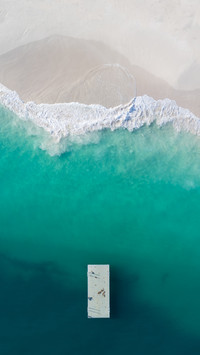 High-angle view of waves hitting the shore