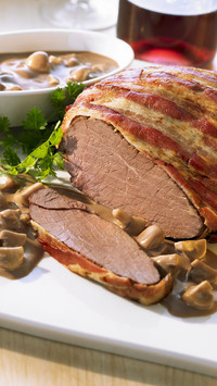 Leg of venison with a madeira and mushroom sauce