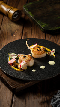 Delicious food on a black plate