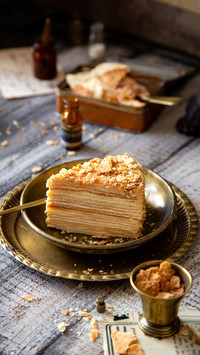 Russian cake napoleon on vintage gold metal plates