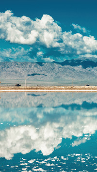 Chaka salt lake reflects the sky like a mirror