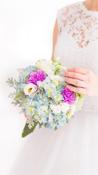 Beautiful Wedding Bouquet in Hands of the Bride