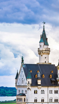 Neuschwanstein Castle, Germany, with lakes and mountains.