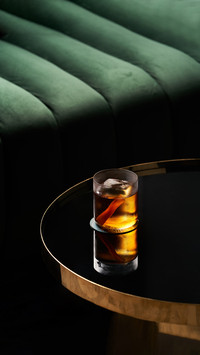 Fresh cocktail glass on glass table in night club restaurant