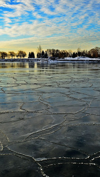Dawn breaks through the ice lake's morning light