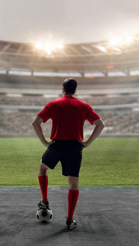 Football player standing with ball