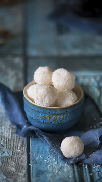 Coconut balls in a turquoise bowl