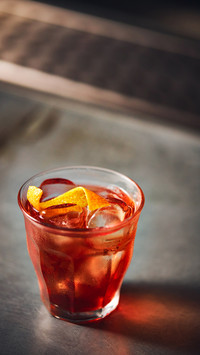 Old fashioned whiskey cocktail on bar