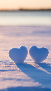 Two heart-shaped snowballs