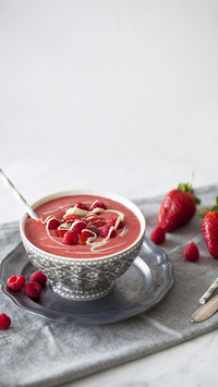 Refreshing strawberry and raspberry smoothie topped with