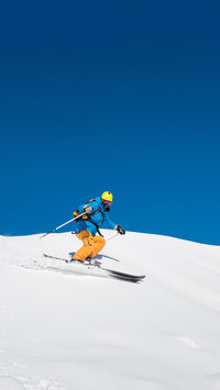 A professional freeride skier is skiing in the Carpathians