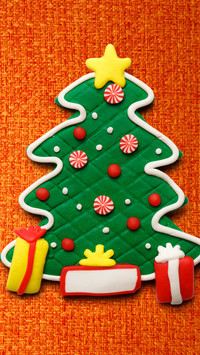 Colorful Candies and Gifts Adorn the Green Christmas Tree