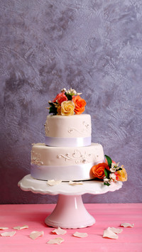White wedding cake decorated with flowers