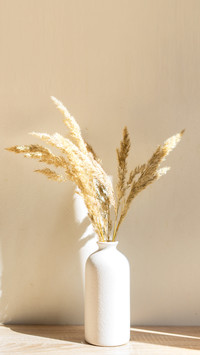Portrait frame mock up with dried flowers on wooden table