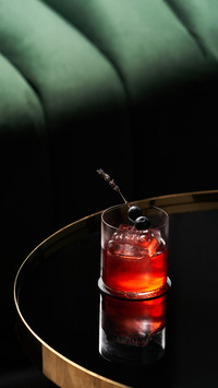 Classic Cocktail Glass on Glass Table in Night Club Restaura