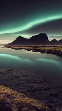 The aurora gently kisses the tundra