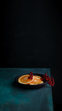 Orange fruit studio turquoise blue background