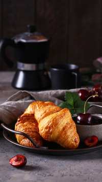 Fresh croissants with jam for breakfast