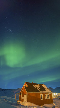 Beautiful Aurora over Wooden House
