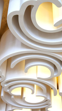 Arc-shaped lighting illuminates the hall