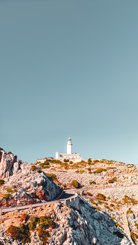 Lighthouse at the famous landmark rock on a bright sunny day