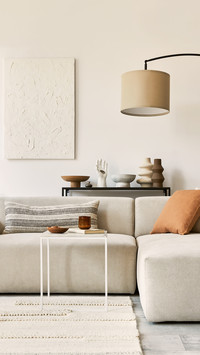 Living Room With Structure Painting And Corner Sofa