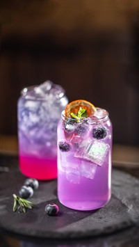 Purple Cocktails on the Dark Table