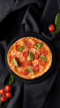 Homemade Pizza with Mozzarella and Cherry Tomatoes