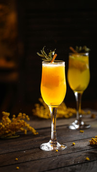 Cocktails multi fruit with orange and ice drops