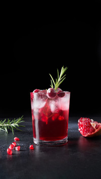 Cocktail with Rosemary, Champagne, Club Soda on Black Table