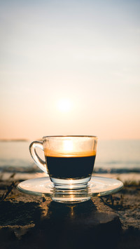 Coffee ready to drink from mug on the beach picnic
