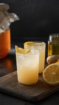 Two Glasses of Lemon Juice With Ice Cubes