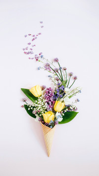Waffle cone with lilac flower, lily of the valley
